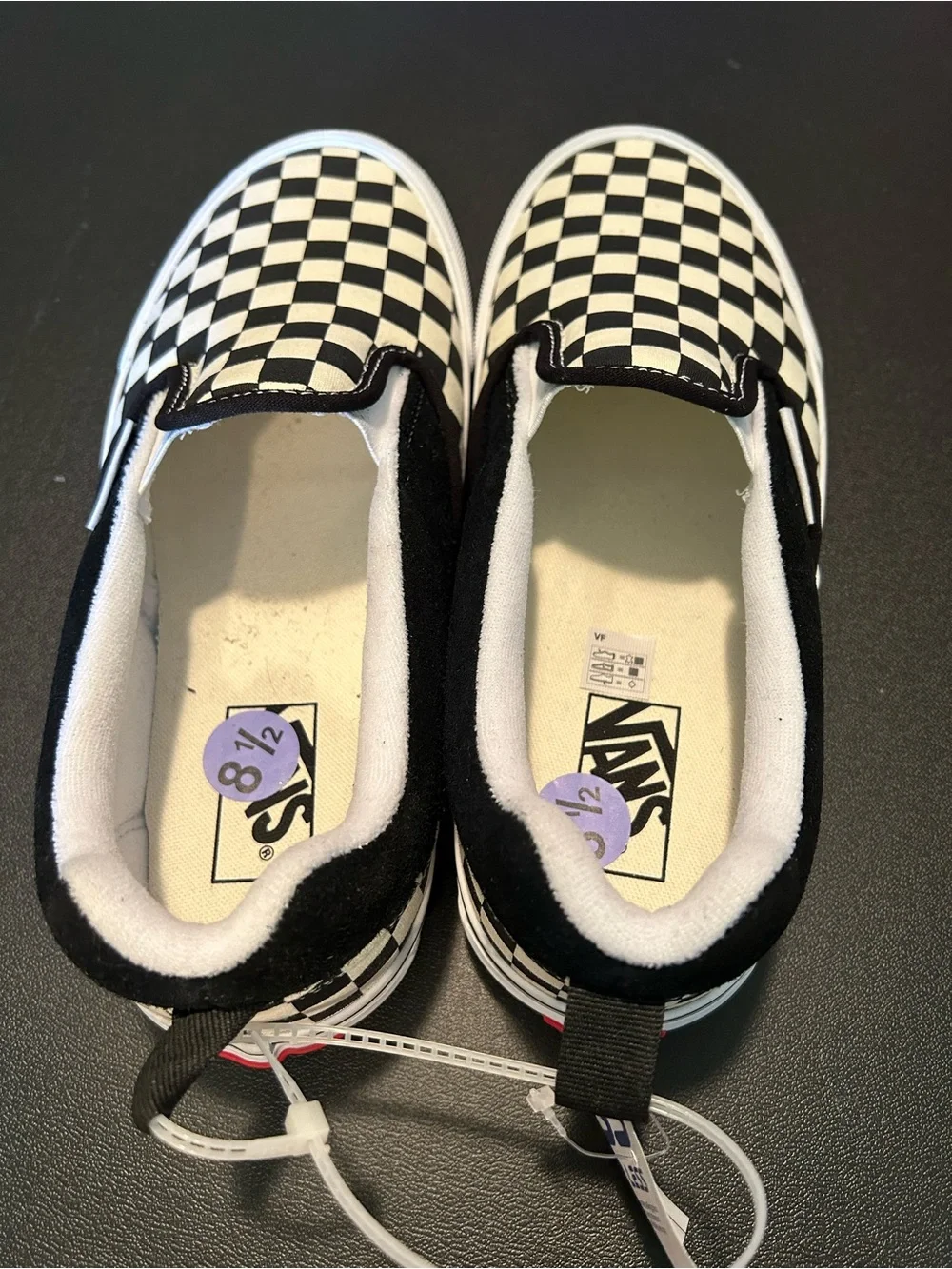 white & black checkered Vans slip-on sneakers in US 8.5